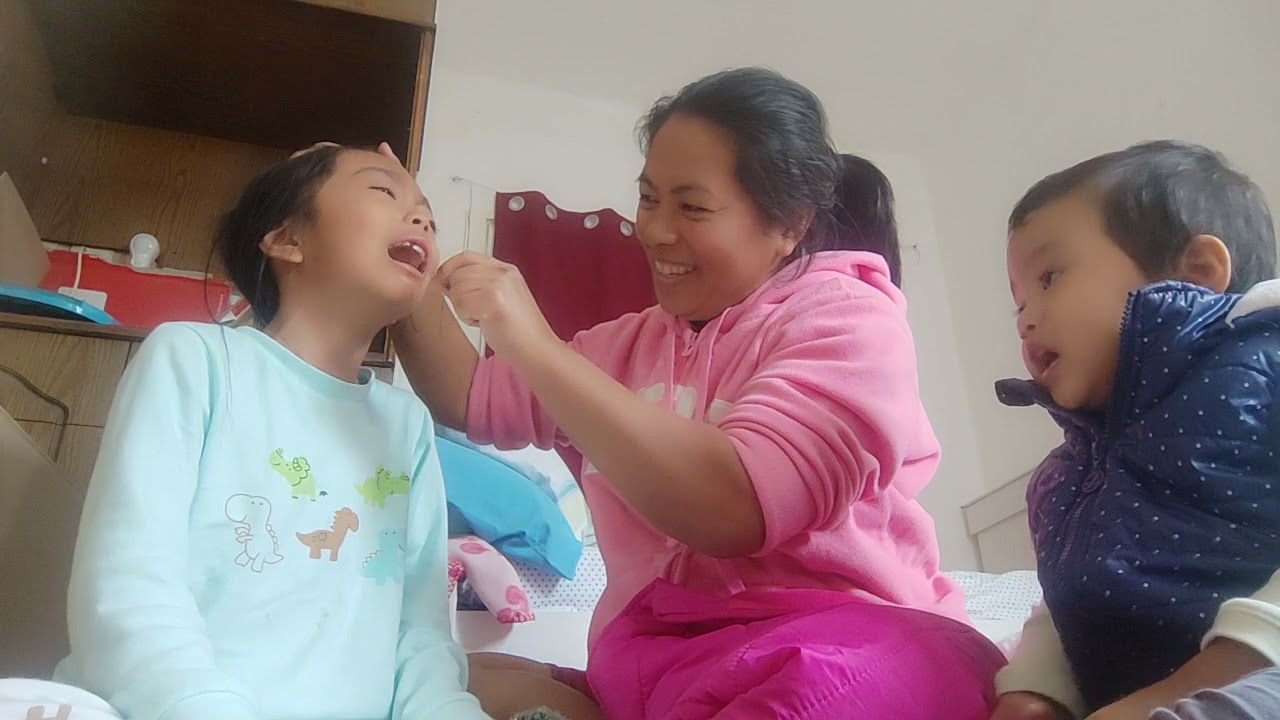 pulling out loose tooth