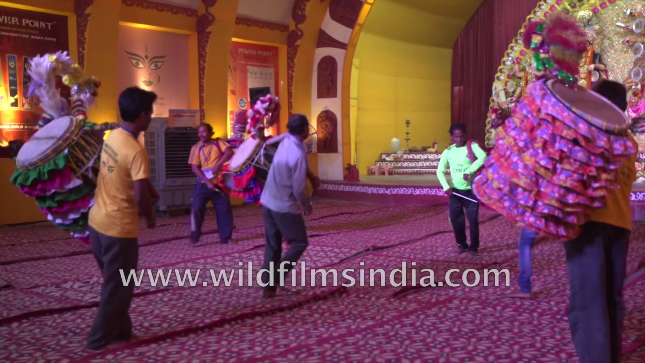 Dhakis play dhak Bengali drums and dance on the occasion of Durga Puja