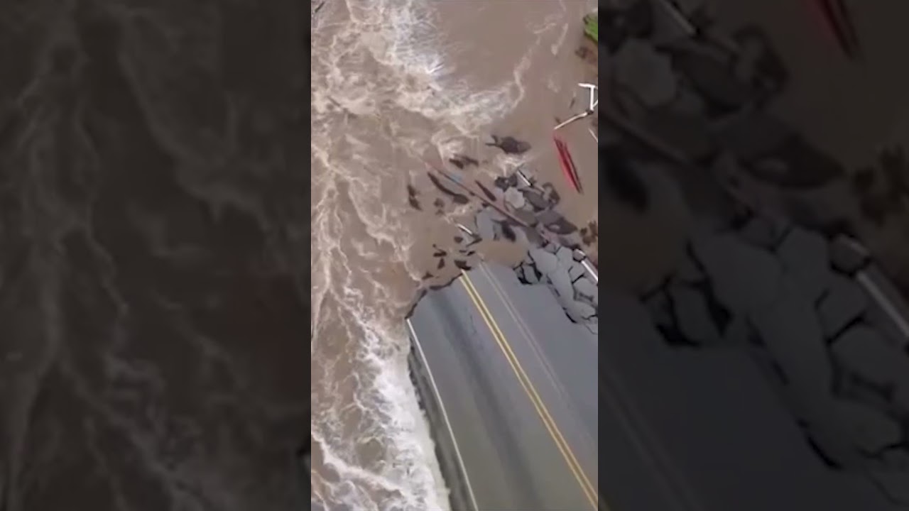 Raging floodwaters wash away road in historic Indiana flooding #shorts