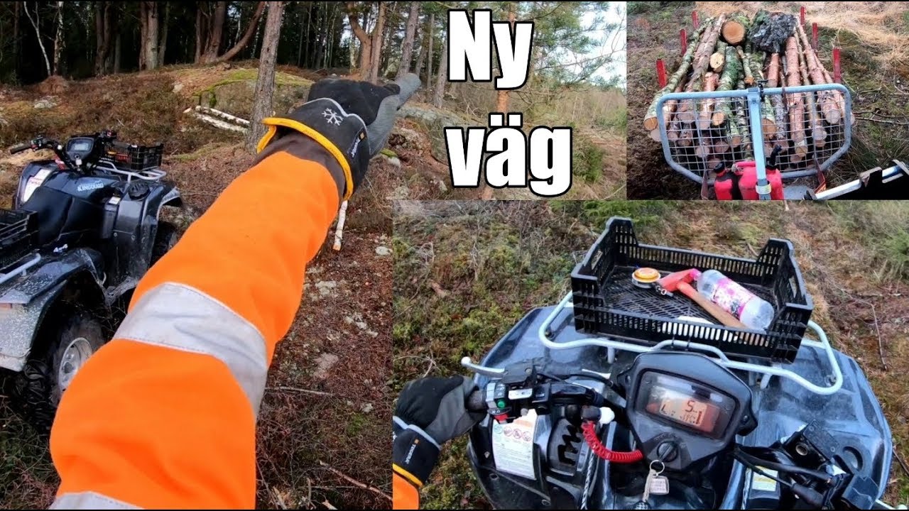 Hämtar hem ett lass ved i tuff terräng i skogen med fyrhjulingen!