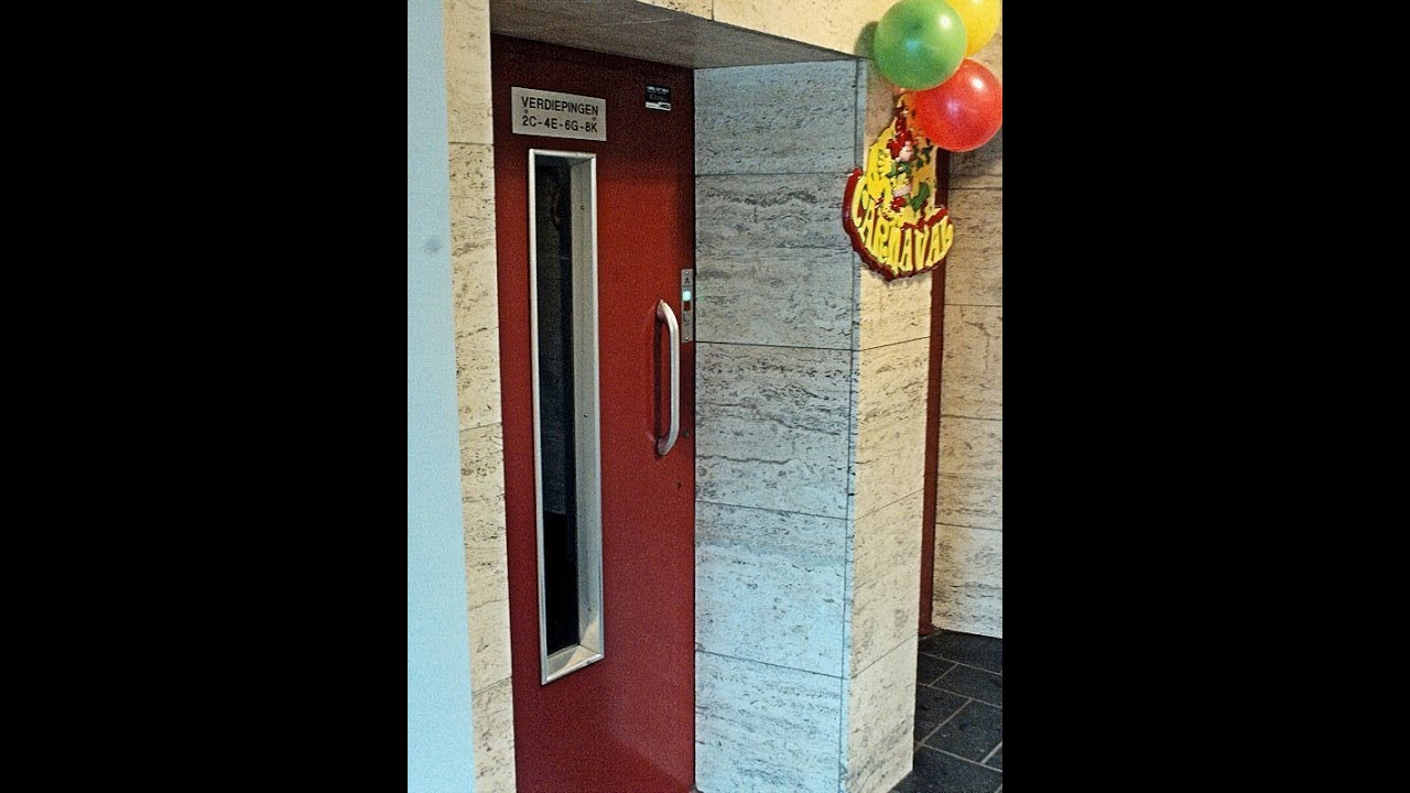 1963 De Reus odd / even elevators without inner doors at Koningsresidentie Maastricht, Netherlands