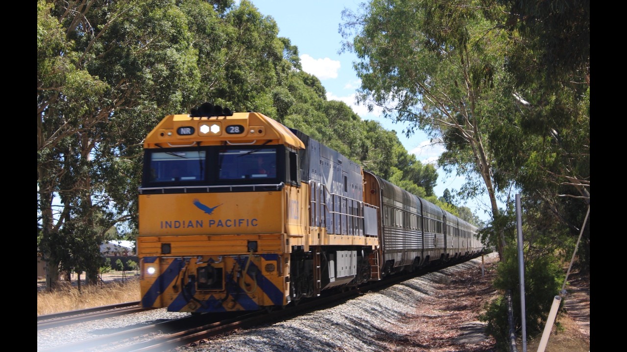5AP8, the Indian pacific tourist trip train, is approaching its Arrival into Perth, NR28 leading.