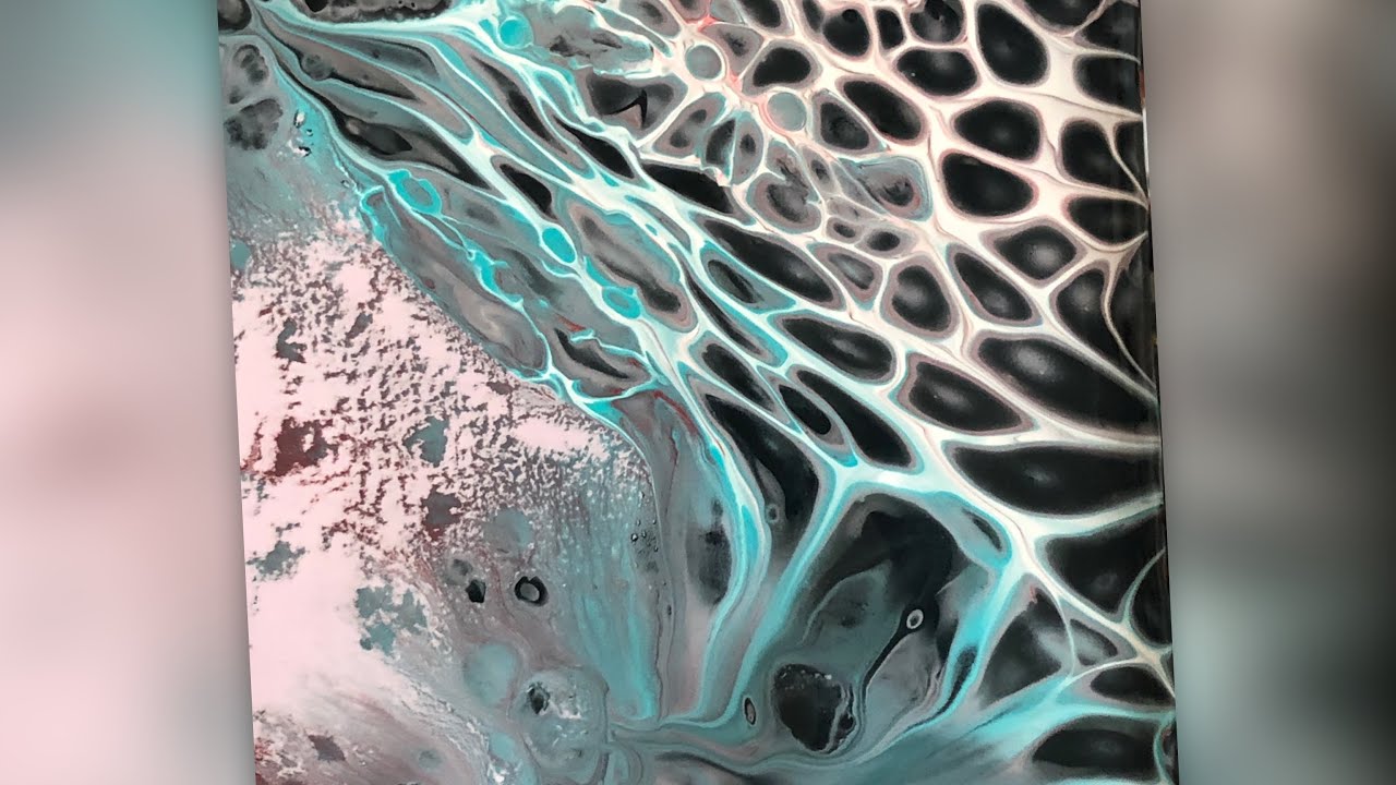 Mad scientist at work on acrylic pouring process with milk paints and acrylics and a jug