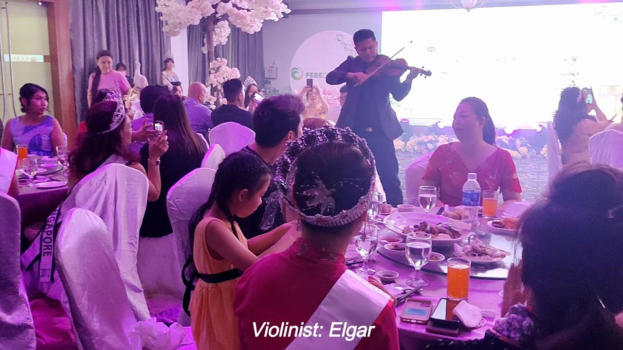 Singapore violinist performs for a Mrs Singapore pageant dinner