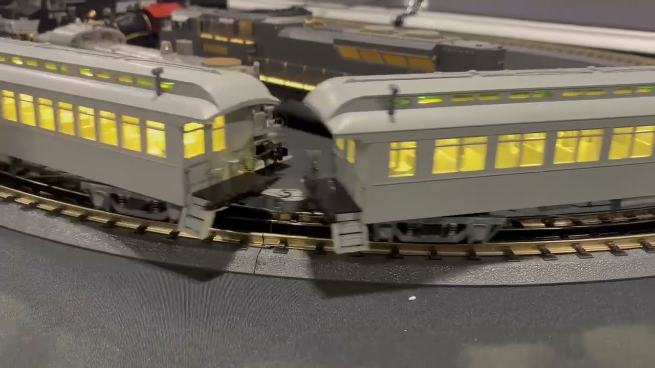 01/25/26 Steam engine passenger train on a small layout at the Big E train show. Old coaches 
