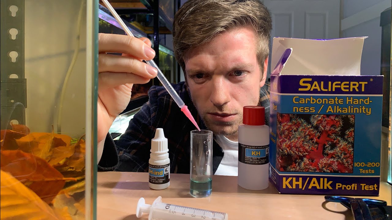 Why is it important to test for carbonate hardness (KH) in aquariums?
