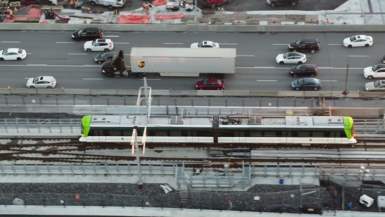Montreal by drone - REM train with a stop at Nuns Island station