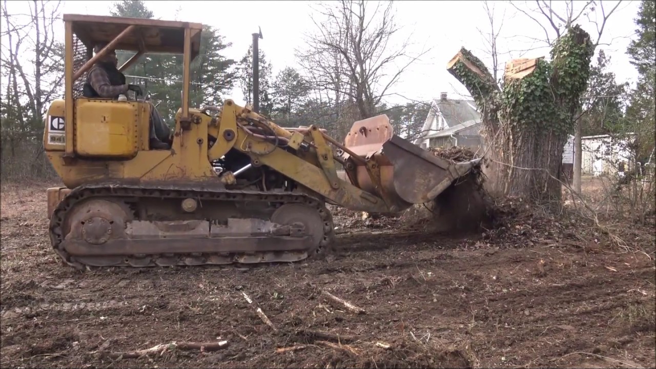 Clearing some brush and logs with Cat 941 Traxcavator (Day 2)