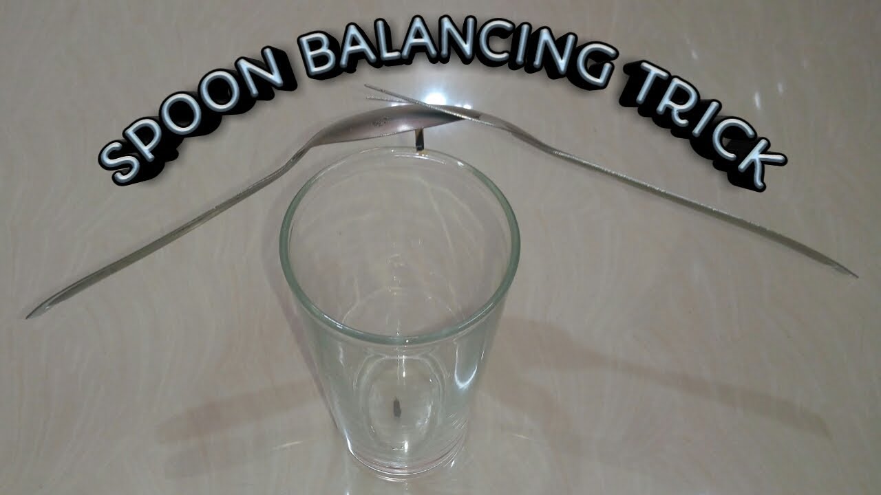 How to balance a fork and spoon on a glass | spoon and fork balancing trick. center gravity. #shorts