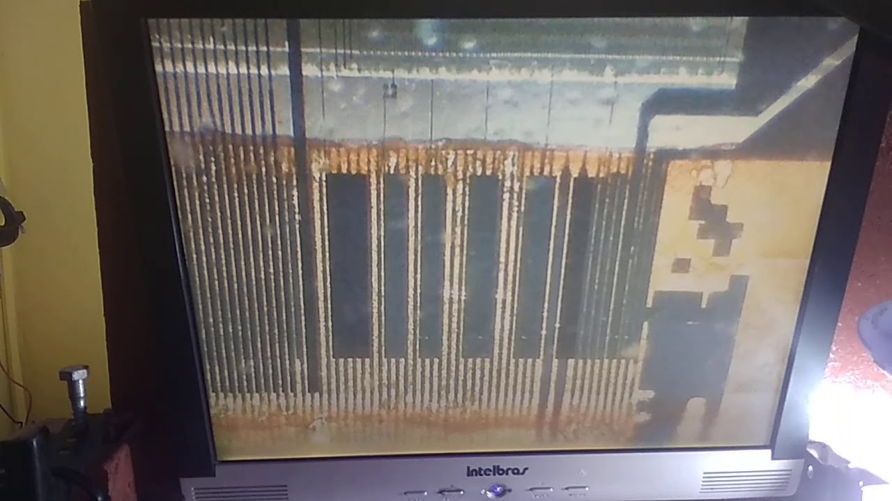 Colagem do lado do display na máquina de acf