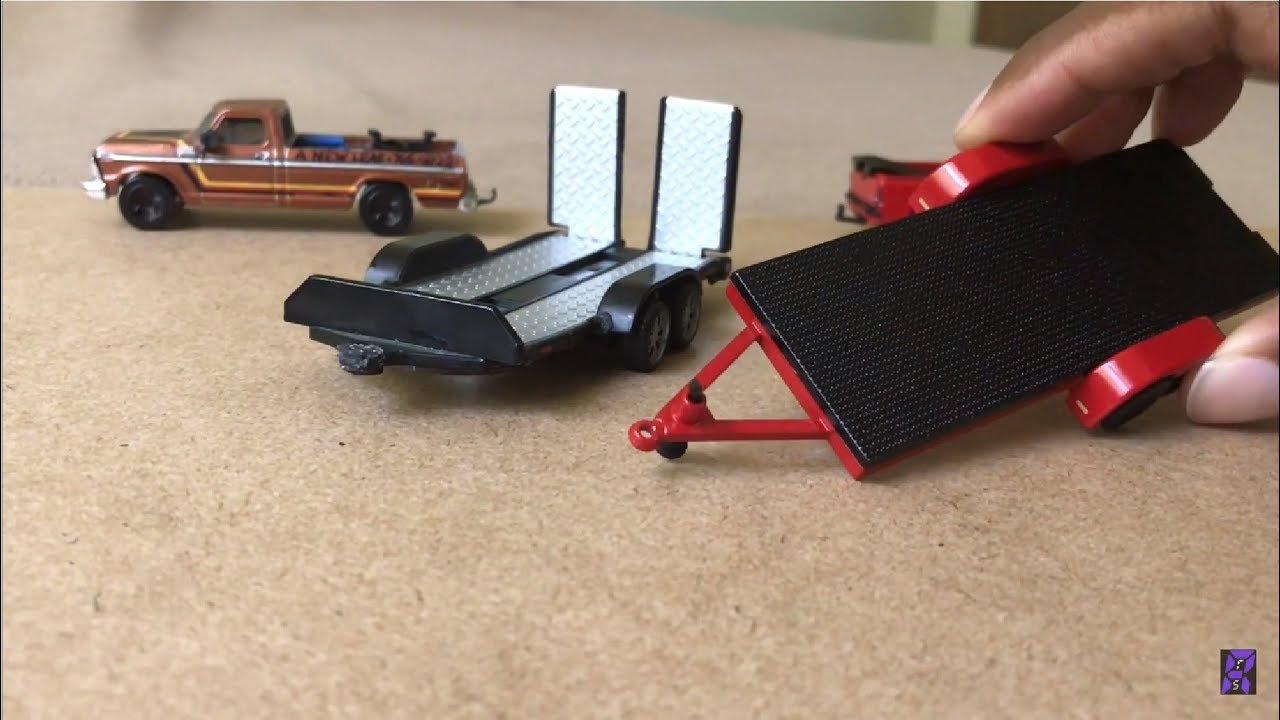 Flatbed Car Trailer Comparison: Johnny Lightning v. Maisto