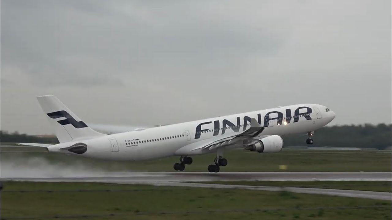 Finnair Airbus A330-302 (OH-LTR) takeoff from wet Helsinki September 13, 2023.
