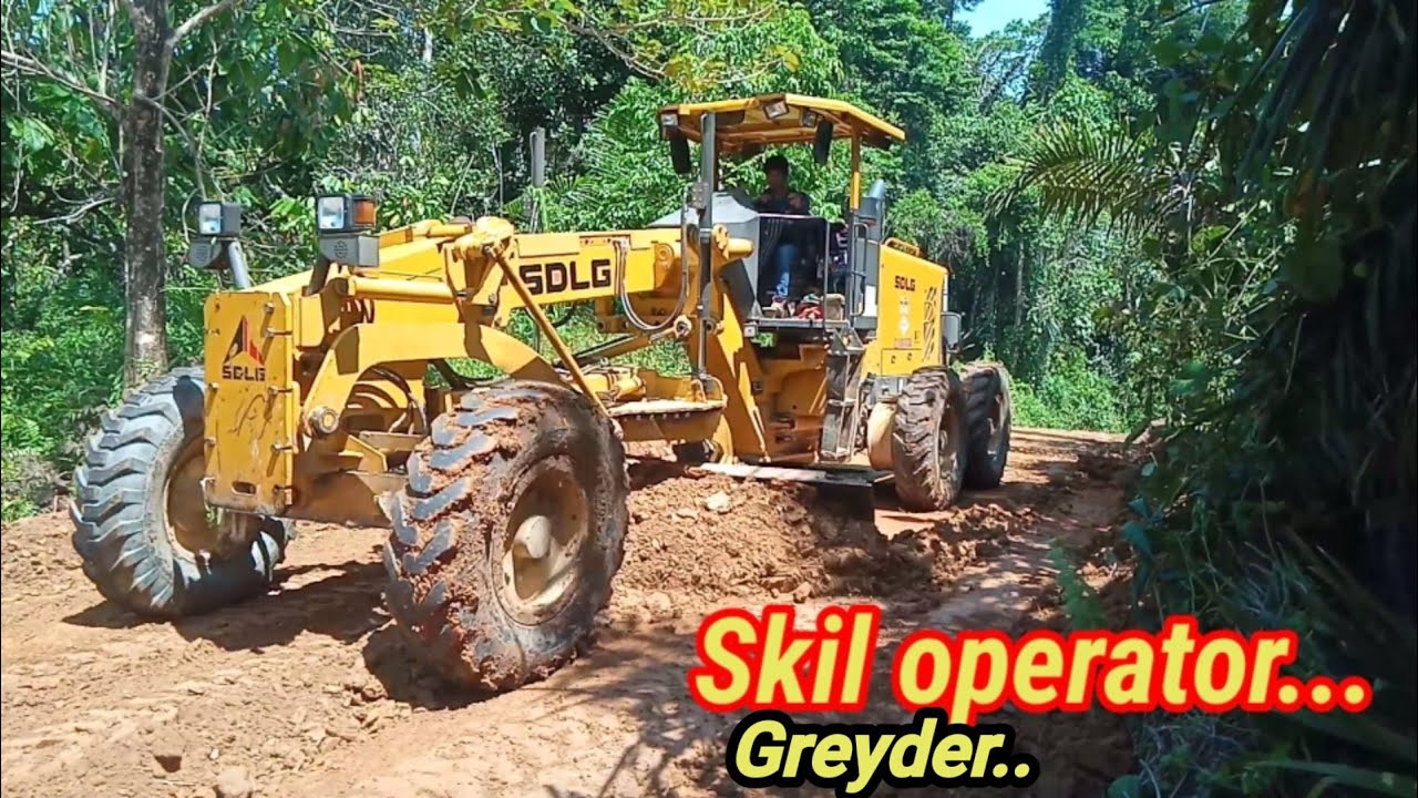 Membentuk Badan jalan Dengan Alat Grader SDLG