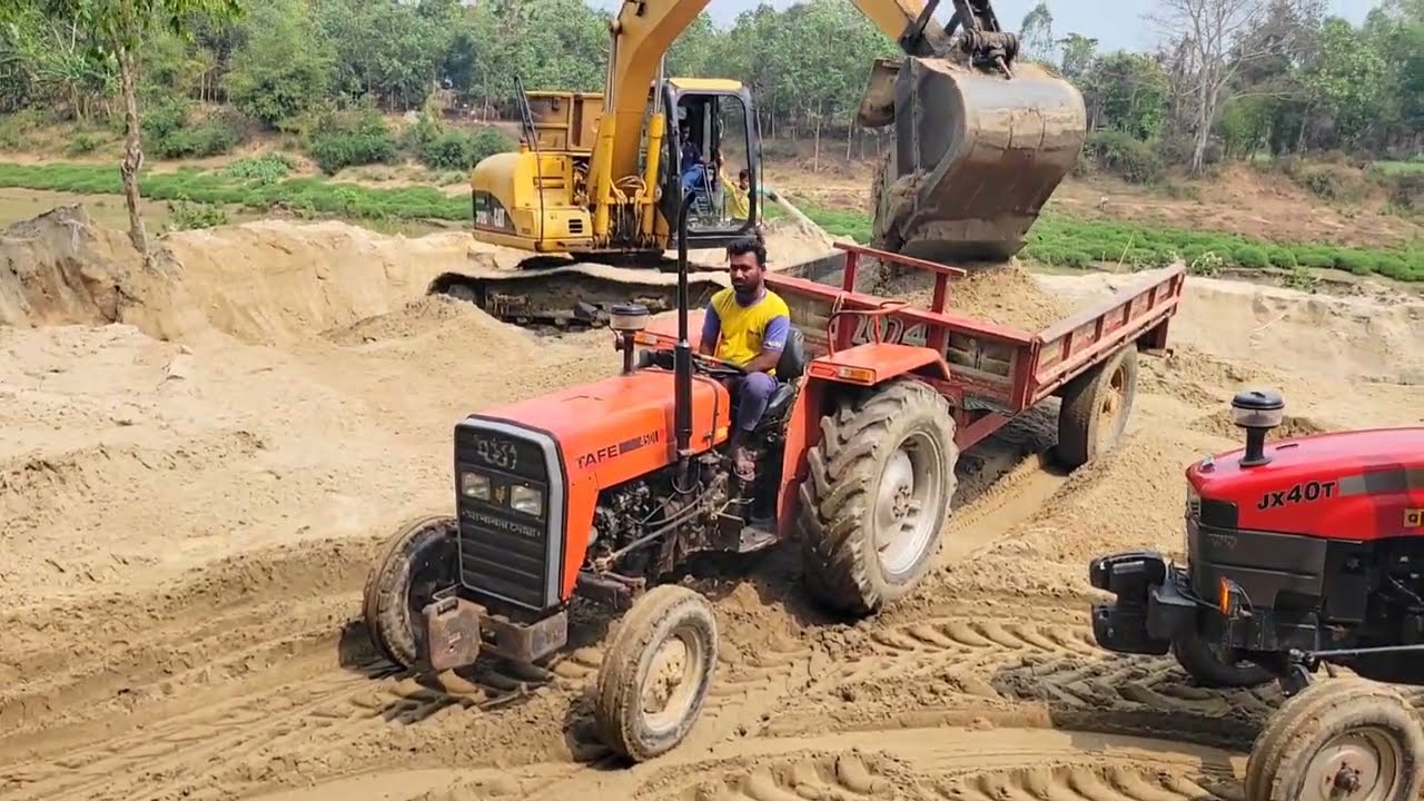 All My Tractors Arrived Together In The Field, Loaded By A Backhoe Machine, Then Left With The Load