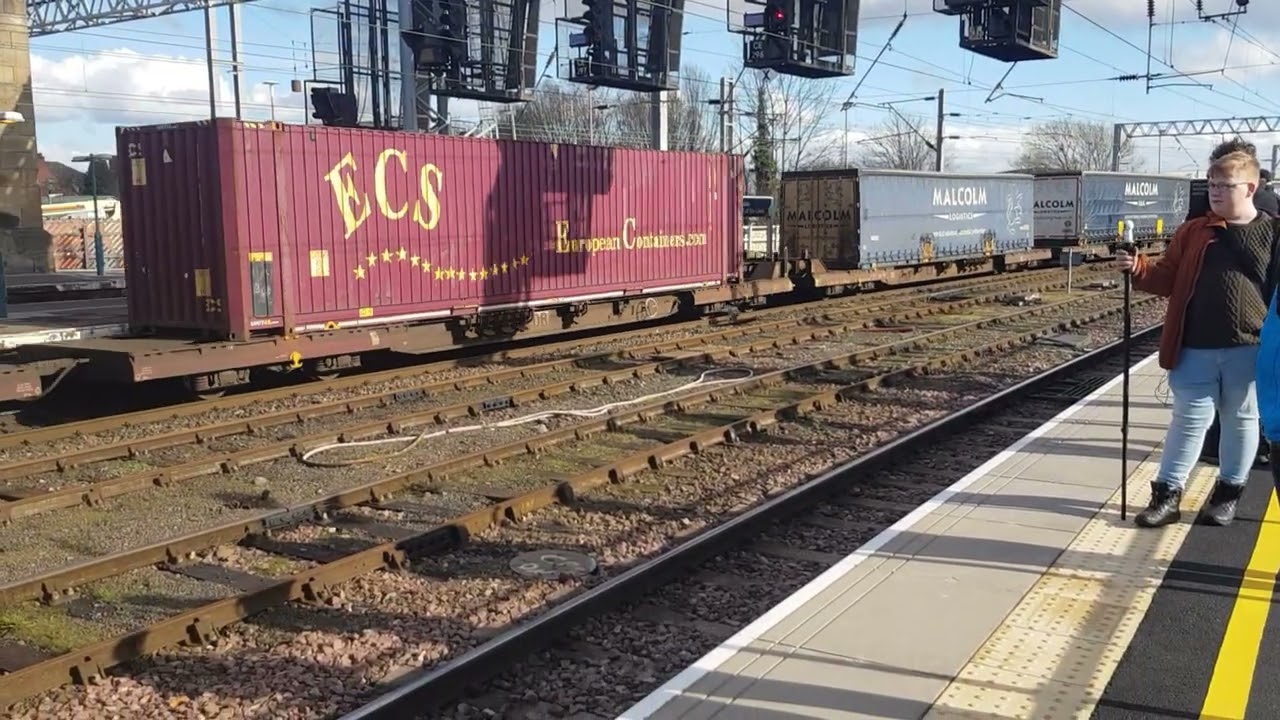 66199 depart Carlisle on a Mossend - Daventry run. 12th March 2022.