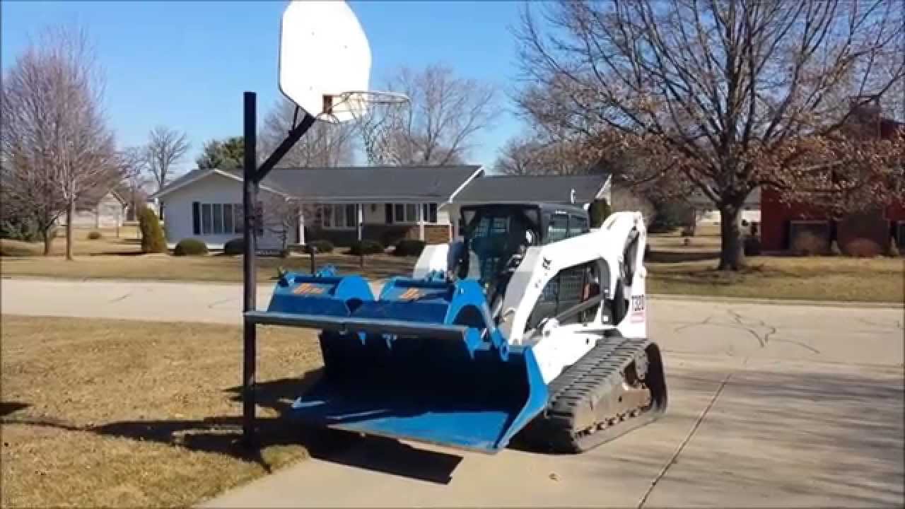 Demo Dozer Video - Removal of Basketball & Clothes Line Poles