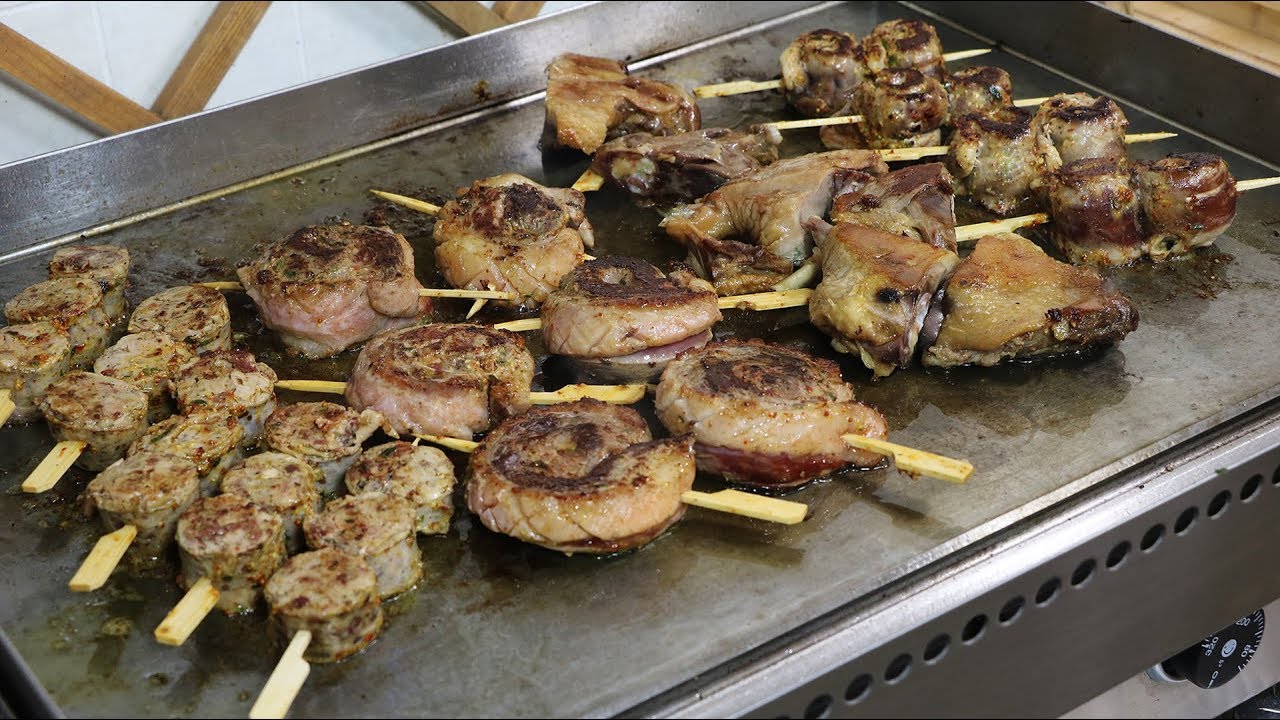 Parrillada autour du canard, sauce au poivre Vert