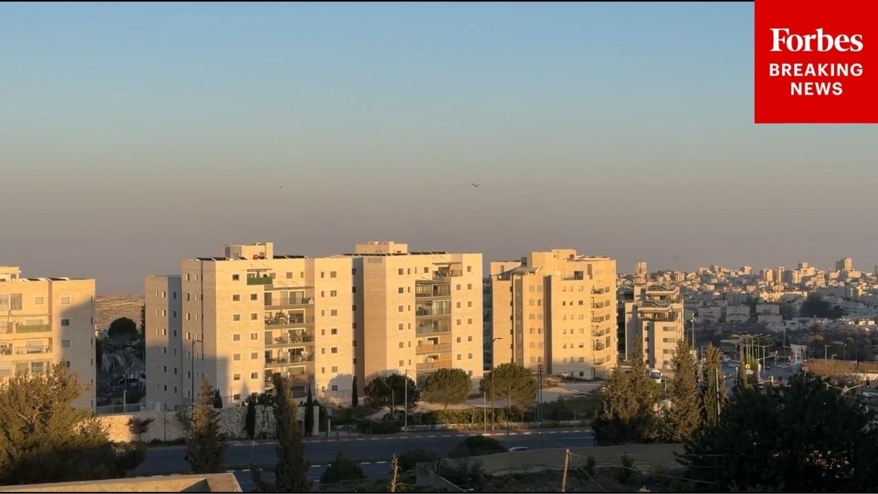 Air Raid Sirens Go Off As Missiles Soar Over Jerusalem, Leaving Air Trails