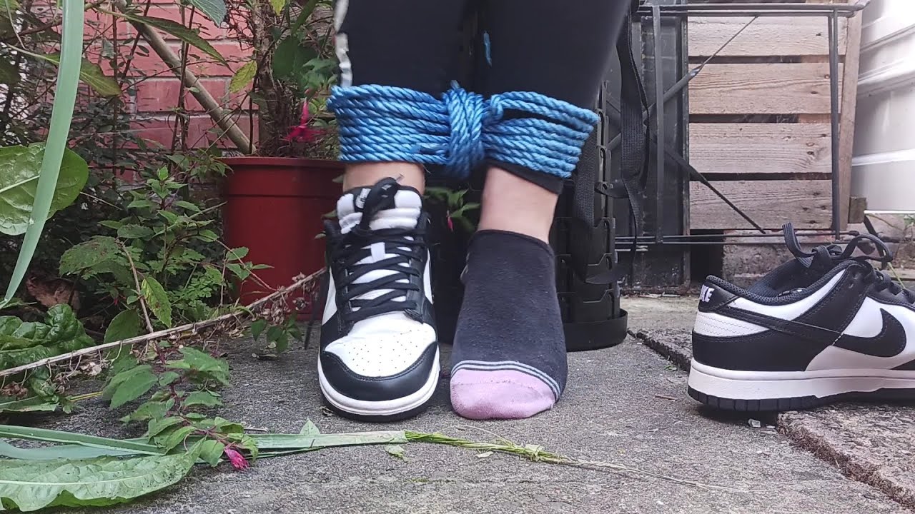 Struggling in Nike Panda Dunks and Ankle Socks.