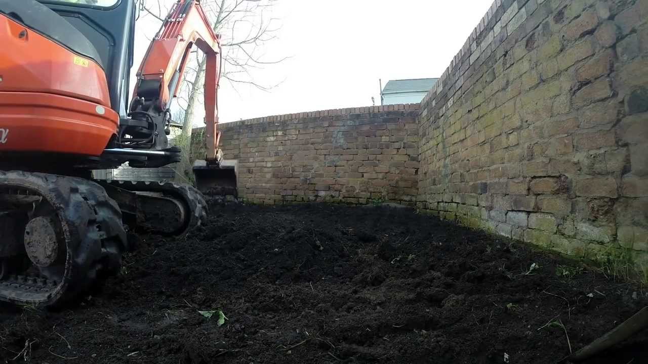 Kubota U25-3 Mini Digger Leveling A Garden