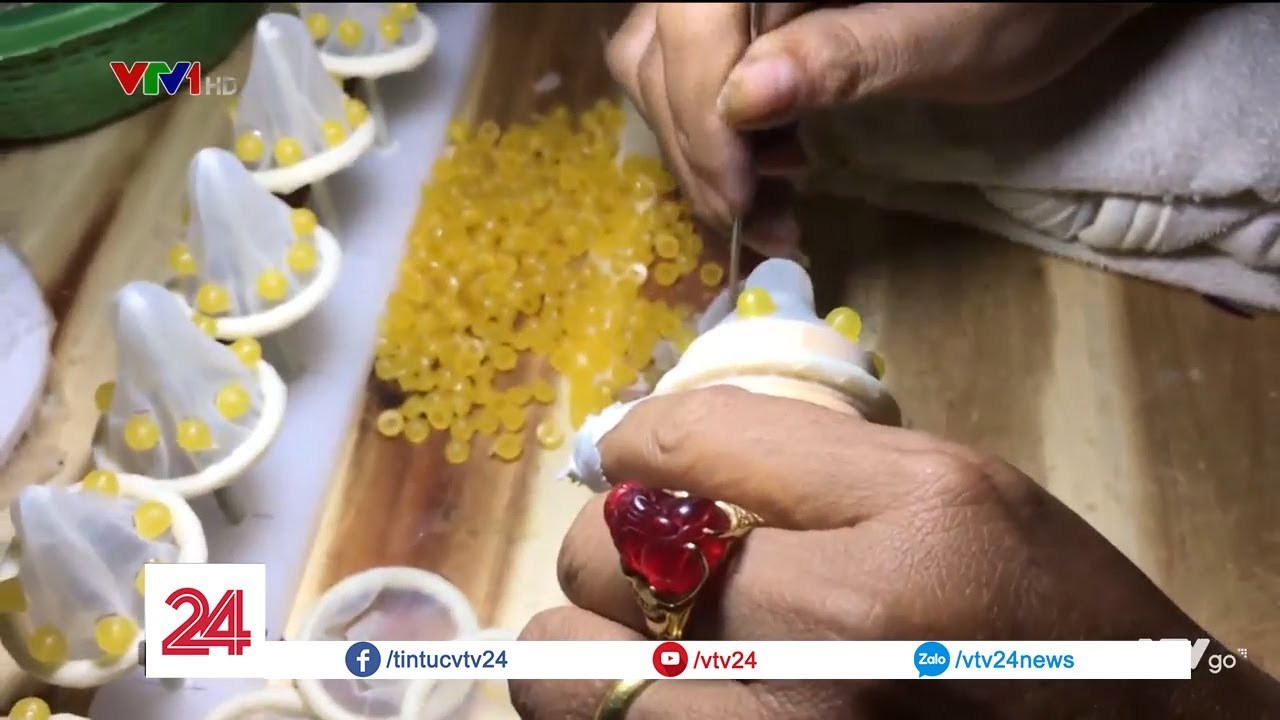 Bên trong cơ sở sản xuất bao cao su giả bằng tay | VTV24