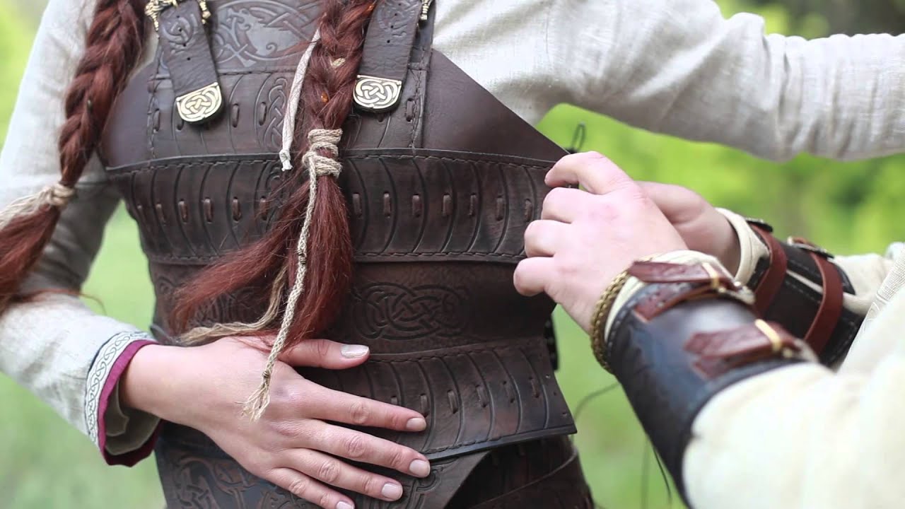 Arming a Viking lady for the battle. 
