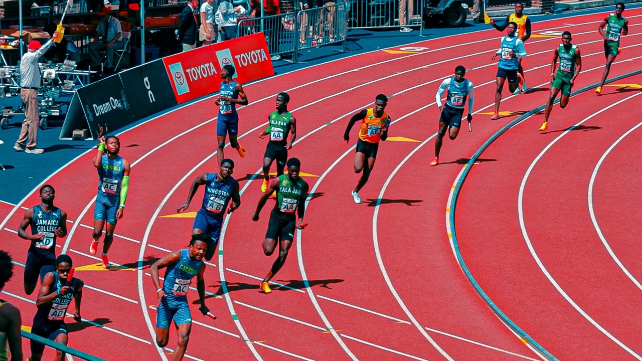 JAMAICA VS AMERICA 4x1 SHOWDOWN 🔥 | CALABAR AND ARCHBISHOP GO AT IT AT 2025 PENN RELAYS!