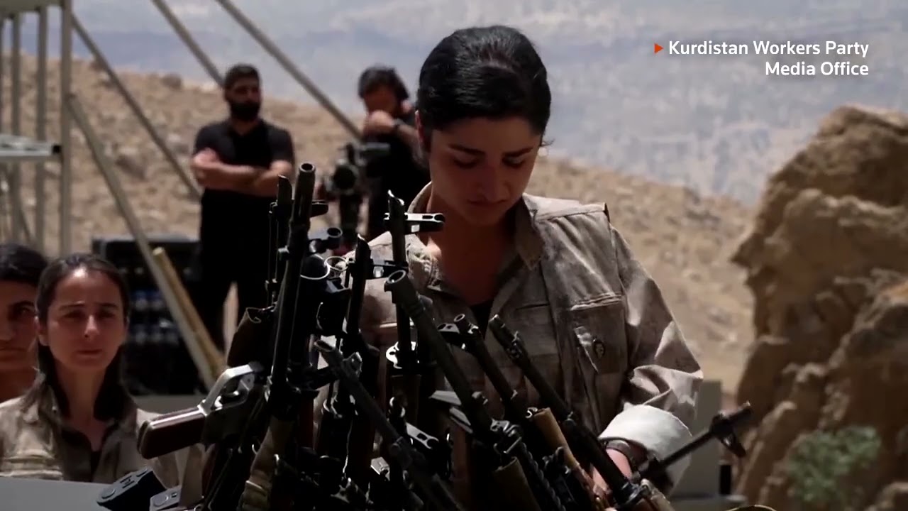 PKK fighters in Iraq burn weapons in disarming ceremony | REUTERS