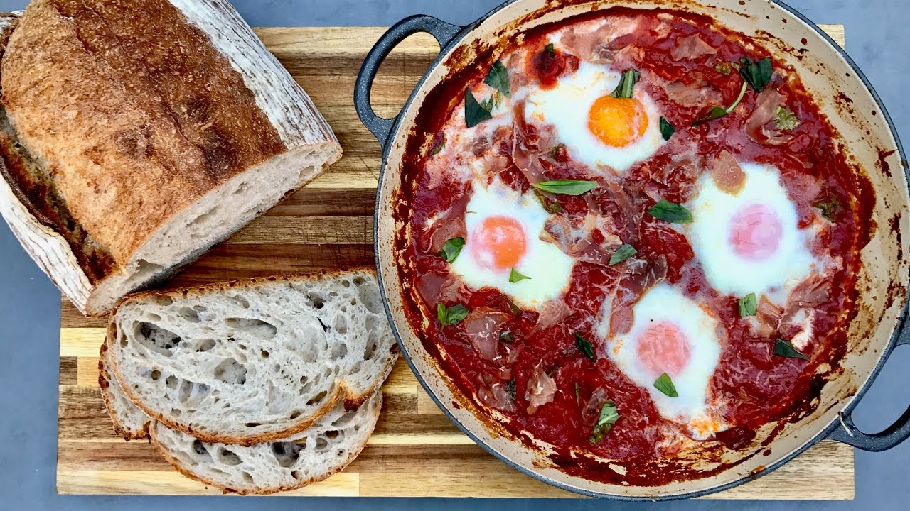 Tomato baked Eggs with basil and parma ham.