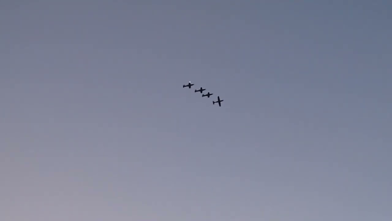 4 airplane formation flying over downtown Kansas City! 