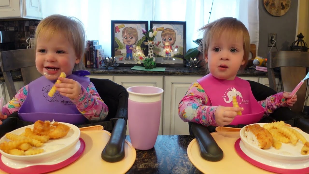 Twins try fish and chips with tartar sauce