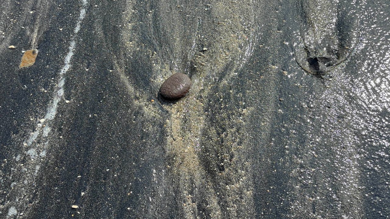 Ephemeral Art on a Black Sand Beach