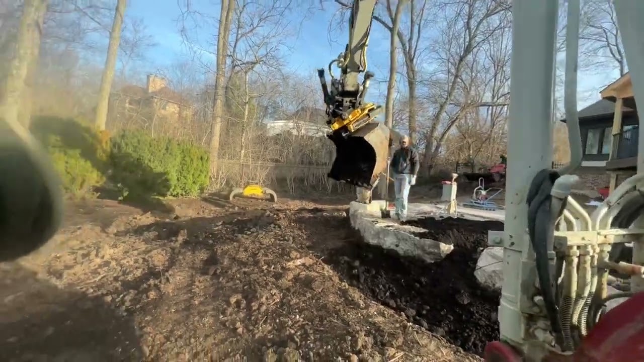 Engcon tilt rotator on Takeuchi tb290 preparing landscape beds
