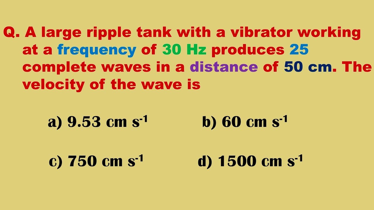 A large ripple tank with a vibrator working at a frequency of 30 Hz produces 25 complete waves in
