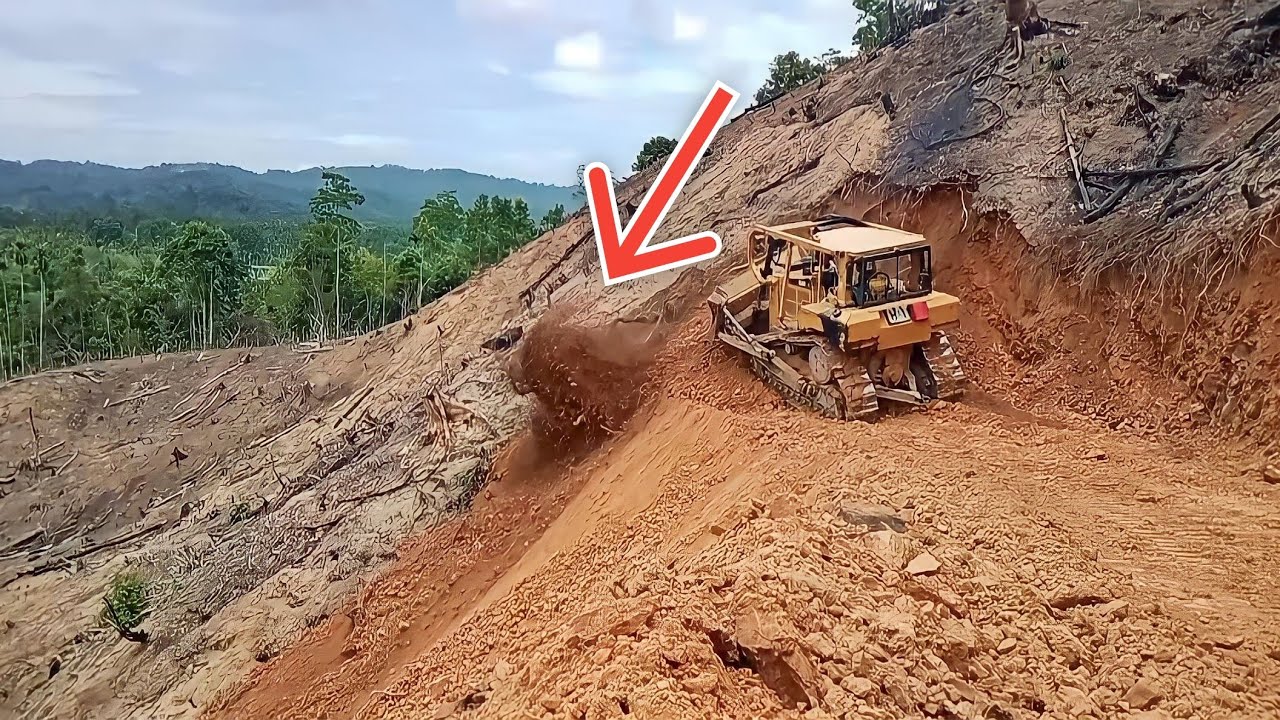 Very extreme BULLDOZER CAT D6R XL works cutting hills to make way
