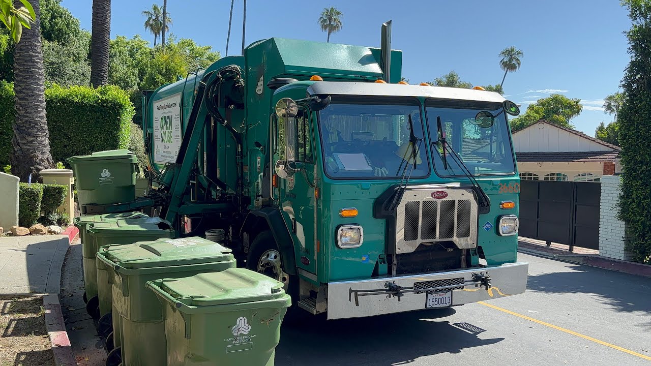 Garbage Trucks collecting long lines of garbage carts
