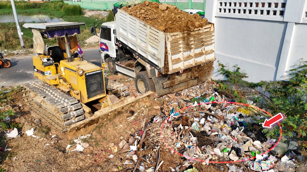 Start a New Project.! Experts Bulldozer Clear Land Trash & Truck fill up Rock Soil Next to the Fence