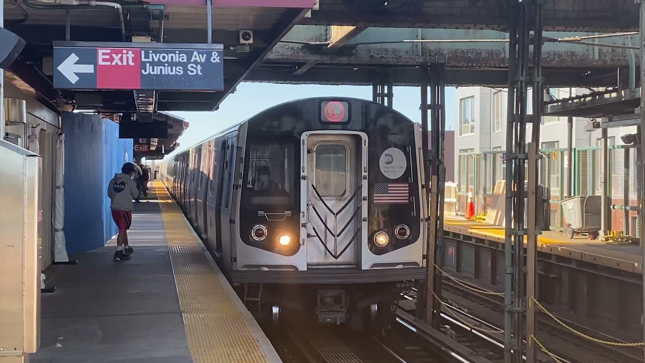 R143/R160A-1 (L) & R62 (3) trains @ Livonia Av (With a NY&AR train passing below!) (Train name tho?)