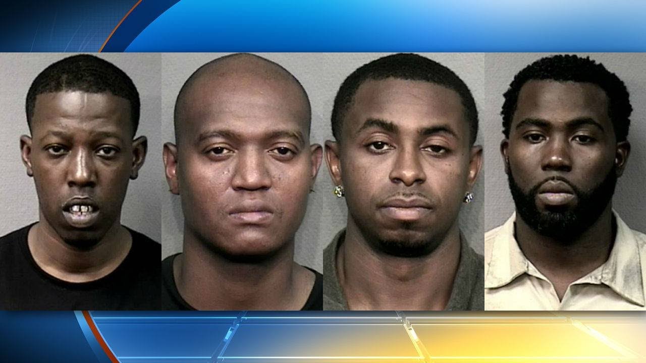 4 men arrested, accused of robbing bank customers