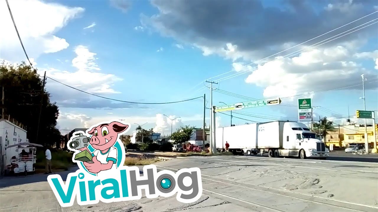 Truck Crosses Train Track at the Worst Possible Time || ViralHog