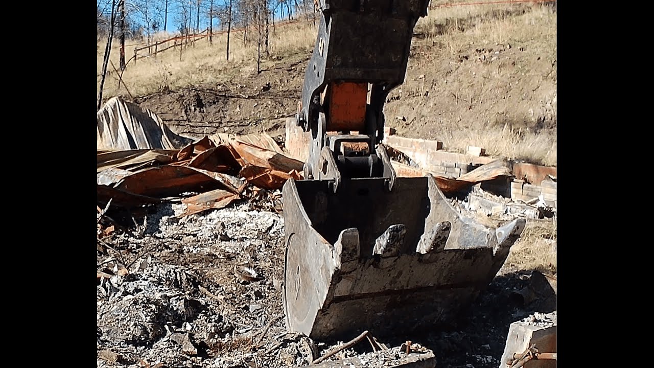 Wildfire burned house cleanup gets started