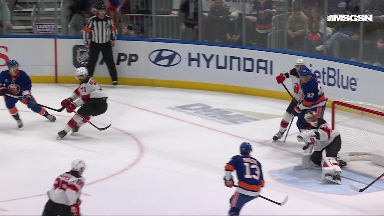 Adam Pelech scores a goal against the New Jersey Devils