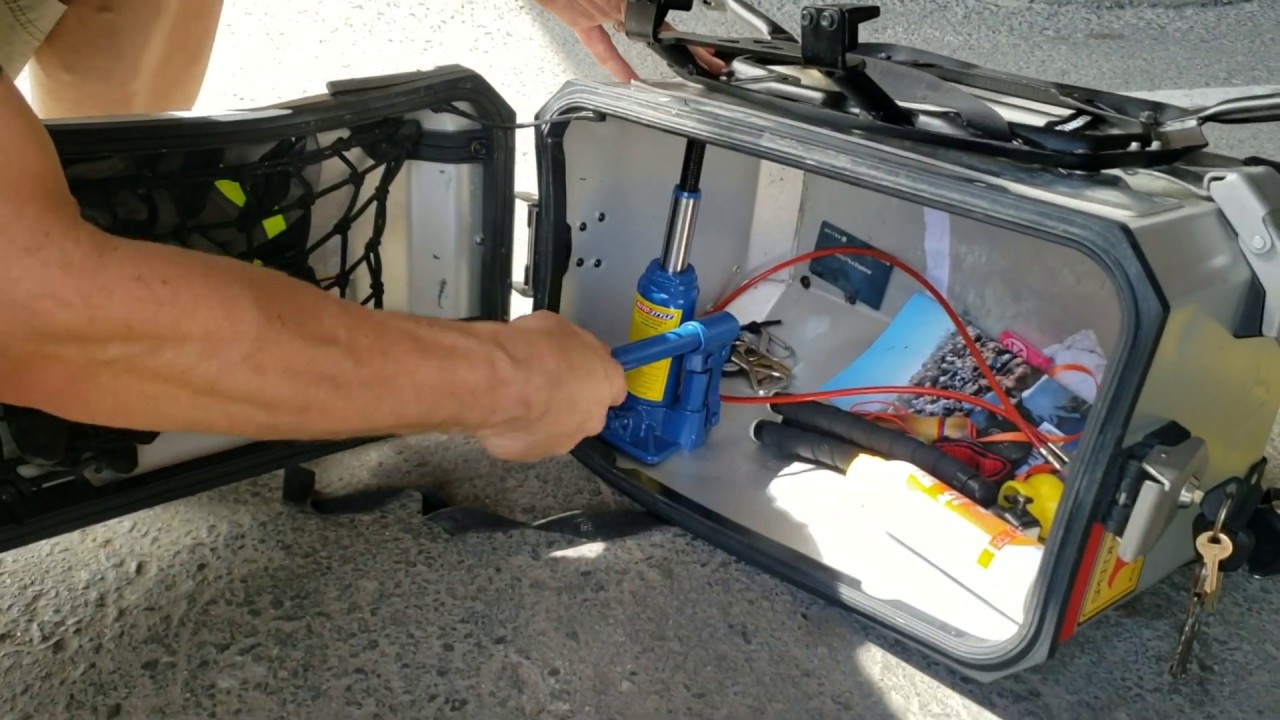 Road side repair of smashed Africa Twin panniers