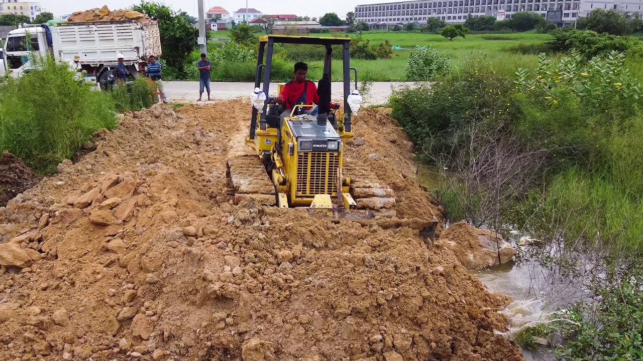 Great Skills Operating a KOMATSU D21P Dozer Pushing Dirt to Build a Road