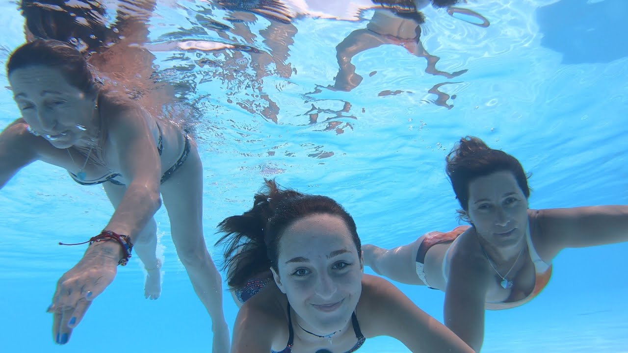 Carla Underwater swimming with my Grandmother and Mom