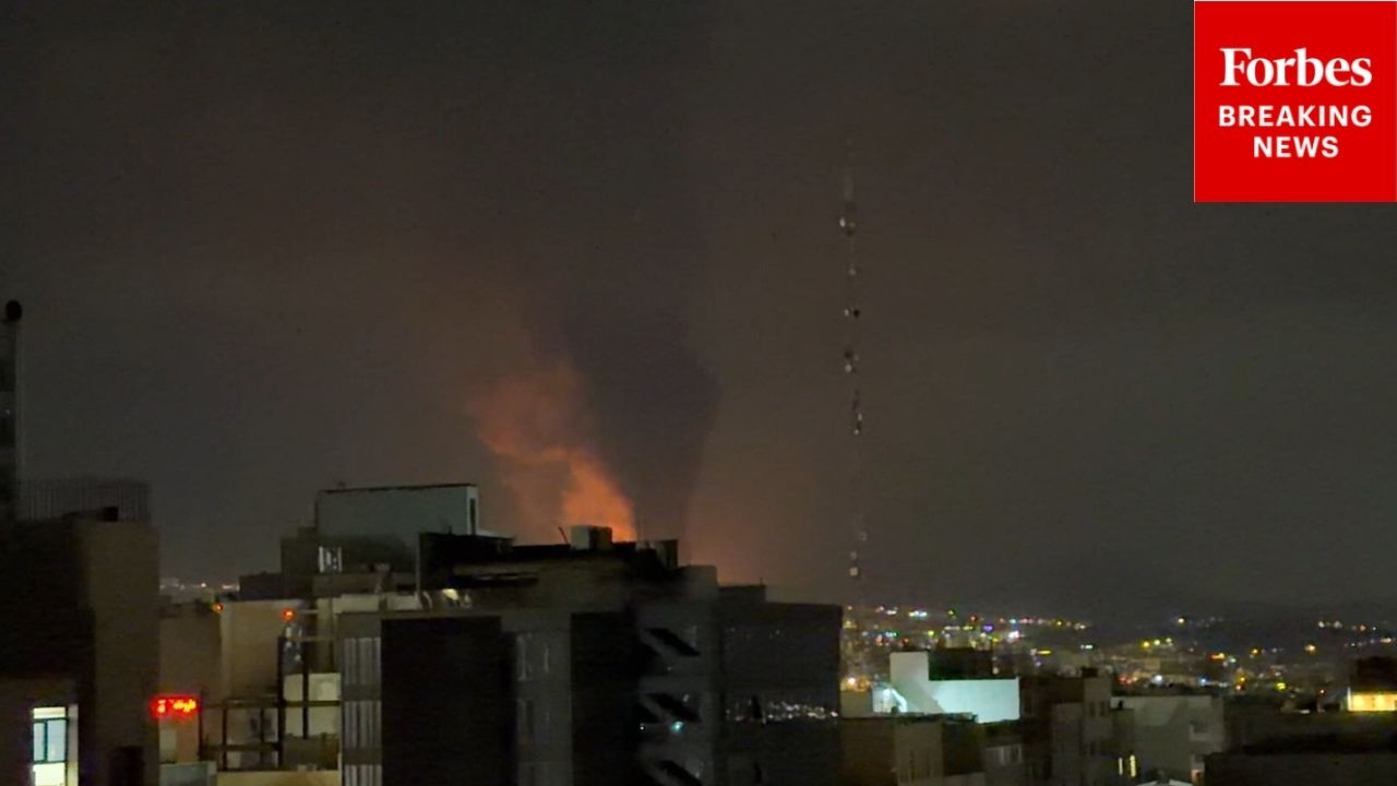 RAW VIDEO: Plume Of Smoke And Fire Rises Above Tehran, Iran, After U.S.-Israeli Strikes