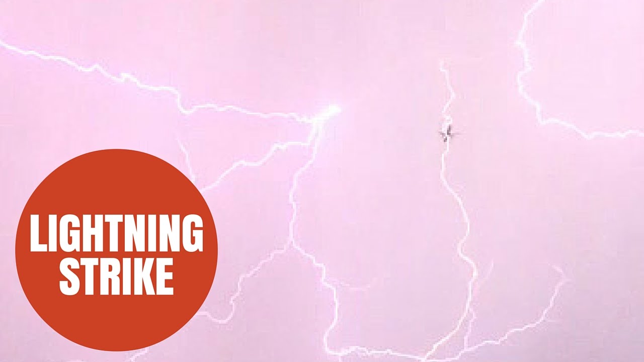 SWNS Video - A bolt of lightning struck a plane on its descent into Heathrow airport last night