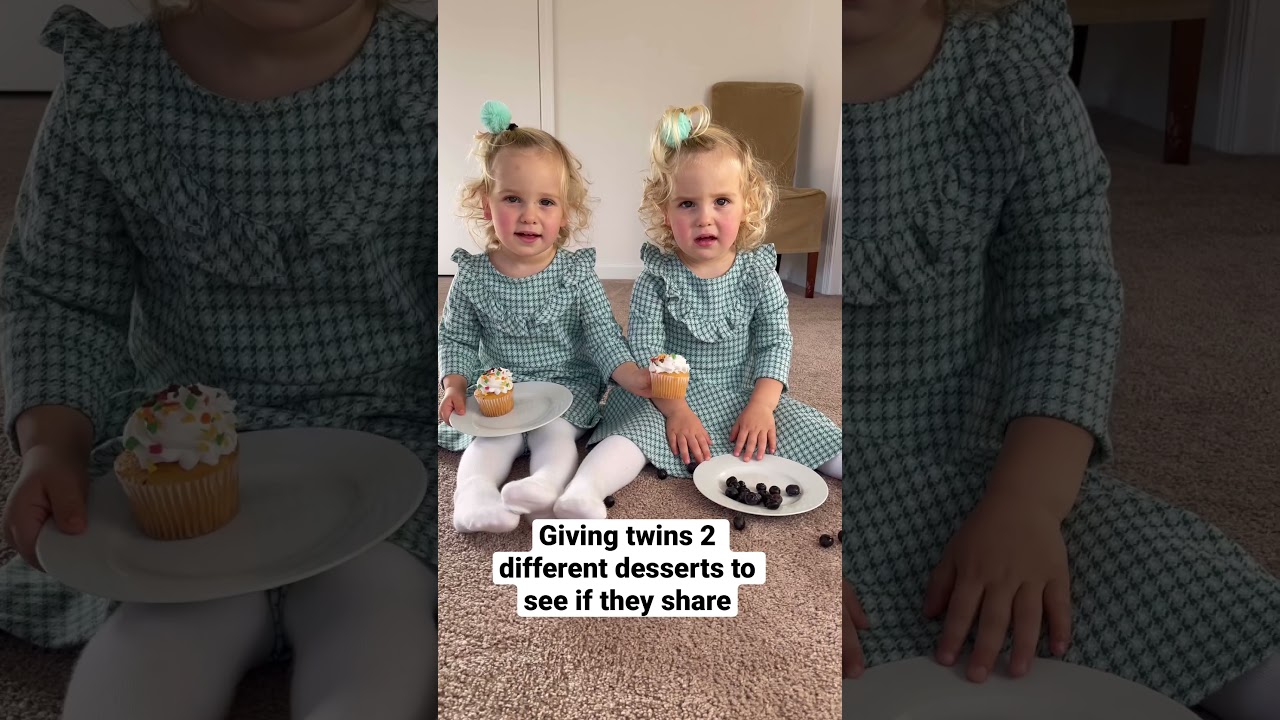 Twin baby girls sharing desserts