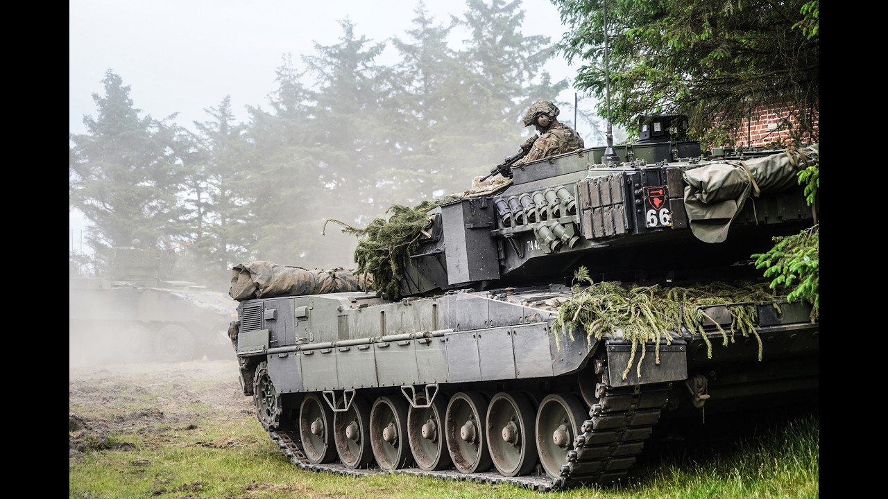 Leopard 2A7 Tanks and Armored Infantry squads training in Oksbøl, Denmark