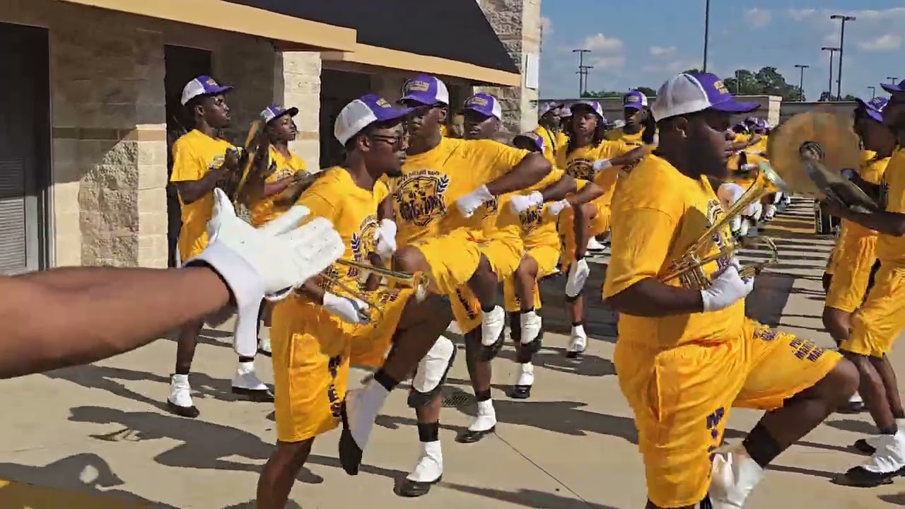 Miles College Purple Marching Machine enters Alabama State Hornets Stadium 
